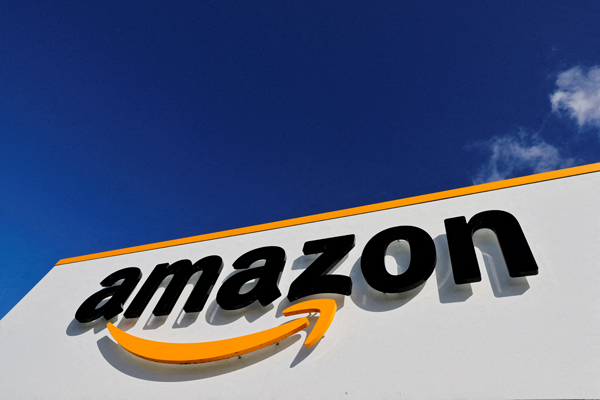 FILE PHOTO: The logo of Amazon is seen at the company's logistics centre in Boves, France, October 6, 2021 REUTERS/Pascal Rossignol/File Photo