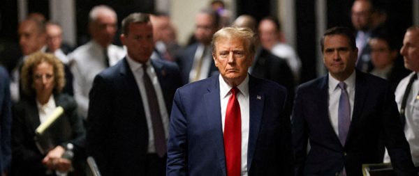 FILE PHOTO: Former U.S. President Donald Trump walks outside the courtroom on the day of a court hearing on charges of falsifying business records to cover up a hush money payment to a porn star before the 2016 election, in New York State Supreme Court in the Manhattan borough of New York City, U.S., February 15, 2024. REUTERS/Andrew Kelly/File Photo